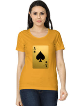 Woman wearing a mustard yellow t-shirt with a playing card design on a white background