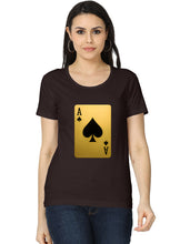 Woman wearing a black t-shirt with a gold and black playing card design on a white background