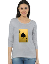 Woman wearing a gray t-shirt with a gold playing card ace of spades design.