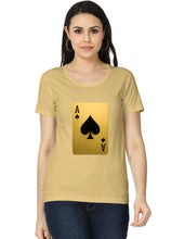Woman wearing a beige t-shirt with a playing card design on a white background