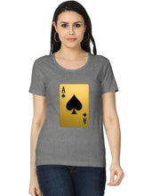 Woman wearing a gray t-shirt with a gold and black playing card design on a white background