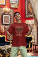 Man wearing a red t-shirt with 'Master the Maze' design in an ornate room.