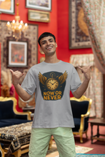 Man wearing a t-shirt with 'Now or Never' design in a decorated room.