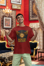 Man wearing a red t-shirt with 'Now or Never' design in an ornate room.