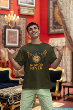 Man wearing a t-shirt with 'Now or Never' design in a decorated room.
