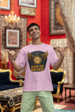 Man wearing a pink t-shirt with a graphic design and text, standing in an ornate room.