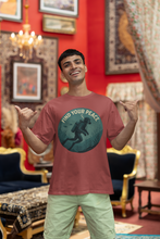 Man wearing a t-shirt with 'Find Your Peace' design in a decorated room.