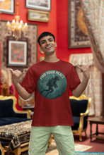 Man wearing a red t-shirt with a graphic design in a decorated room.