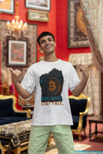 Man wearing a white t-shirt with Bitcoin design and text in an ornate room.