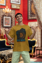 Man wearing a yellow t-shirt with Bitcoin design in an ornate room
