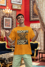 Person wearing an 'Adopt Don't Shop' t-shirt in a decorated room.
