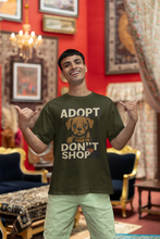 Man wearing a t-shirt with 'Adopt Don't Shop' graphic in a decorated room.