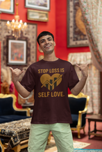 Man wearing a t-shirt with a motivational message in an ornate room.