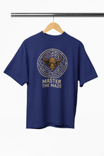Blue t-shirt with bull and maze design on a hanger against a white background
