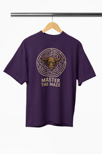 Purple t-shirt with bull head maze graphic and 'Master the Maze' text on a hanger.