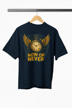 Black t-shirt with a clock graphic and 'NOW OR NEVER' text on a hanger against a white background