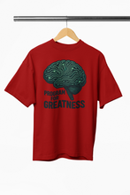 Red t-shirt with a brain graphic and 'Program for Greatness' text on a hanger.