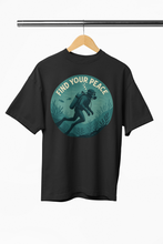 Black t-shirt with a graphic of a diver and 'Find Your Peace' text on a hanger.