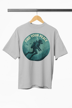 Gray t-shirt with 'Find Your Peace' scuba diving graphic on a hanger against a white background