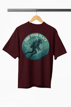 Maroon t-shirt with a graphic of a diver and 'Find Your Peace' text on a hanger.