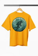 Yellow t-shirt with 'Find Your Peace' graphic on a hanger against a white background