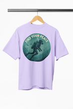 Lavender t-shirt with 'Find Your Peace' graphic on a hanger