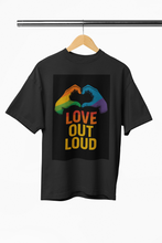 Black t-shirt with rainbow hands and 'LOVE OUT LOUD' text on a hanger against a white background