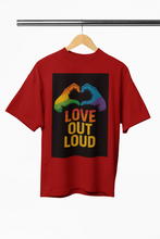 Red t-shirt with 'Love Out Loud' graphic on a hanger against a white background
