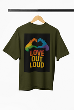 Green t-shirt with 'Love Out Loud' graphic on a hanger against a white background