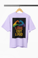 Lavender t-shirt with 'Love Out Loud' graphic on a hanger against a white background