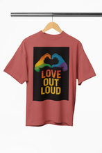 Red t-shirt with 'Love Out Loud' graphic on a hanger against a white background