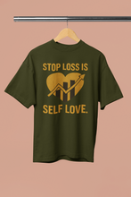 Green t-shirt with yellow text and graphic on a beige background
