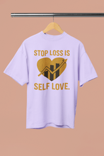 Light purple t-shirt with gold graphic and text on a beige background