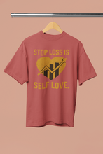 Red t-shirt with yellow graphic and text on a beige background