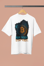 White t-shirt with Bitcoin logo and text on a hanger against a beige background