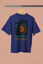 Blue t-shirt with Bitcoin logo and text on a beige background