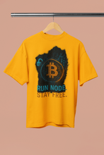 Yellow t-shirt with Bitcoin logo and text on a beige background