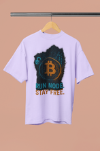 White t-shirt with Bitcoin logo and text on a beige background