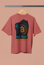 Red t-shirt with Bitcoin logo and text on a beige background