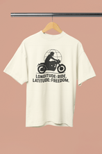 White t-shirt with motorcycle graphic and text on a hanger against a beige background