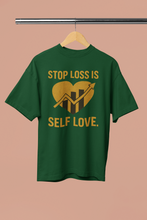 Green t-shirt with yellow text and graphic on a beige background
