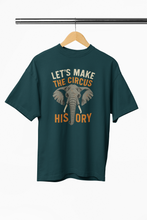 Green t-shirt with elephant graphic and text on a hanger against a white background