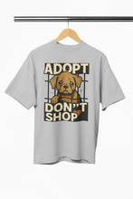 Gray t-shirt with 'Adopt Don't Shop' graphic featuring a dog on a hanger.