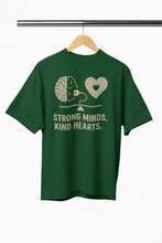 Green t-shirt with a graphic and text on a hanger against a white background