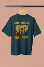 Green t-shirt with yellow text and graphic on a beige background