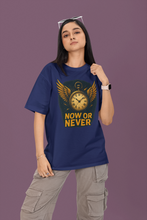Person wearing a blue t-shirt with a graphic design and text on a purple background