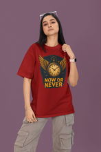 Person wearing a red t-shirt with a graphic design and text on a purple background