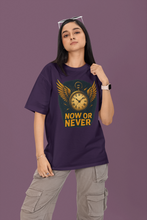 Person wearing a purple t-shirt with a graphic design and text on a purple background