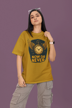 Person wearing a mustard yellow t-shirt with a graphic design and text on a purple background