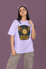Person wearing a light purple t-shirt with a graphic design and text on a purple background